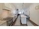 Spacious kitchen featuring stainless steel appliances, a center island, and an open view to the living area at 224 Bass Sw St, Atlanta, GA 30315