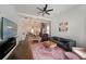 Open-concept living area with modern decor, spiral staircase, and hardwood floors, perfect for entertaining at 224 Bass Sw St, Atlanta, GA 30315