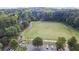 Overhead shot of a large open green space, with mature trees and walking paths, in a well-maintained community park at 234 Pam Sw Ln, Marietta, GA 30064