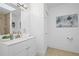 Bright bathroom with white vanity, skylight, and bath shower combo at 234 Pam Sw Ln, Marietta, GA 30064