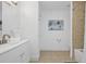 Bathroom with tile flooring, white vanity, and bath shower combo at 234 Pam Sw Ln, Marietta, GA 30064