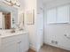 Bathroom vanity featuring decorative mirror, faucet, and tile flooring at 234 Pam Sw Ln, Marietta, GA 30064