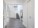 Bright foyer with high ceilings, hardwood floors, and staircase leading to upper level, creating an open and airy entrance at 234 Pam Sw Ln, Marietta, GA 30064
