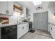 Contemporary kitchen featuring stainless steel appliances, white cabinetry, granite countertops, and modern finishes, offering style and convenience at 234 Pam Sw Ln, Marietta, GA 30064