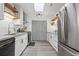 Modern kitchen with white cabinets, granite countertops, stainless steel appliances, and ample storage space, showcasing functionality at 234 Pam Sw Ln, Marietta, GA 30064