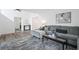 Open-concept living area with hardwood floors, contemporary decor, and seamless flow for entertaining and relaxation at 234 Pam Sw Ln, Marietta, GA 30064