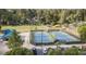Aerial view of well-maintained tennis courts, parking, and green spaces, offering a vibrant recreation opportunity at 234 Pam Sw Ln, Marietta, GA 30064