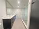 Spacious bathroom with glass shower, double sink vanity and large mirror at 788 W Marietta Nw St # 905, Atlanta, GA 30318