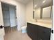 Bright bathroom featuring a modern vanity and spacious walk-in closet at 788 W Marietta Nw St # 905, Atlanta, GA 30318