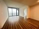 Open bedroom with floor-to-ceiling windows, hardwood floors, and neutral walls at 788 W Marietta Nw St # 905, Atlanta, GA 30318