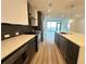 Modern kitchen featuring an island, stainless steel appliances, and dark backsplash at 788 W Marietta Nw St # 905, Atlanta, GA 30318