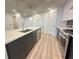 Modern kitchen featuring a stainless steel dishwasher, oven, and stone countertops at 788 W Marietta Nw St # 905, Atlanta, GA 30318
