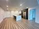 Bright and modern kitchen with an island, stainless steel appliances, and hardwood flooring at 788 W Marietta Nw St # 905, Atlanta, GA 30318