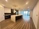 Open concept kitchen with island, stainless steel appliances, and hardwood floors throughout at 788 W Marietta Nw St # 905, Atlanta, GA 30318