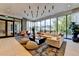 Sunlit lobby with stylish seating, modern lighting, and large windows overlooking greenery at 788 W Marietta Nw St # 905, Atlanta, GA 30318
