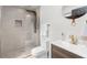 Bathroom showcases shower with glass door, mosaic tile, and modern vanity at 1959 Oana Sw St, Atlanta, GA 30310