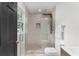 Modern bathroom features a glass-enclosed shower, stylish tile work, and updated fixtures and fittings at 1959 Oana Sw St, Atlanta, GA 30310