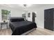 Bedroom with gray bed, black door, and natural light from windows at 1959 Oana Sw St, Atlanta, GA 30310