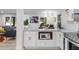 Bright kitchen boasts white cabinets, marble countertops, and stainless steel microwave at 1959 Oana Sw St, Atlanta, GA 30310