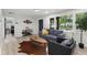 Stylish living area with wood floors, a comfortable couch, and a charming view of the outdoors at 1959 Oana Sw St, Atlanta, GA 30310