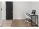 Home office features sleek desk, white chair, and dark accents at 1959 Oana Sw St, Atlanta, GA 30310