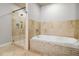 Luxurious bathroom with glass shower and large soaking tub at 20 10Th Nw St # 704, Atlanta, GA 30309