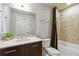 A well-lit bathroom with a tiled shower-tub combination, sleek vanity, and modern fixtures at 20 10Th Nw St # 704, Atlanta, GA 30309