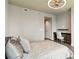 This bedroom features a modern ceiling fan, attached desk and wood floors at 20 10Th Nw St # 704, Atlanta, GA 30309