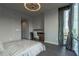 Bedroom featuring a built-in desk, hardwood floors and an inviting modern design at 20 10Th Nw St # 704, Atlanta, GA 30309