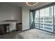 This bedroom boasts a dedicated workspace, large windows and sleek hardwood floors at 20 10Th Nw St # 704, Atlanta, GA 30309