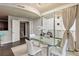 Bright dining area with glass table and chairs, open to balcony at 20 10Th Nw St # 704, Atlanta, GA 30309
