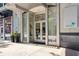 A welcoming entrance with glass doors leads into a luxurious building at 20 10Th Nw St # 704, Atlanta, GA 30309