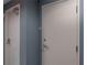 Hallway with doors on a blue wall with suite number 2033 at 20 10Th Nw St # 704, Atlanta, GA 30309