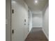 Hallway showcasing ample storage cabinets along the wall, offering practical and organized living space at 20 10Th Nw St # 704, Atlanta, GA 30309