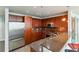 Well-equipped kitchen with stainless steel appliances and dark wooden cabinetry at 20 10Th Nw St # 704, Atlanta, GA 30309