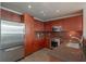 Modern kitchen features stainless steel appliances, granite countertops, ample cabinet space, and hardwood floors at 20 10Th Nw St # 704, Atlanta, GA 30309
