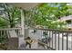 Serene balcony featuring comfortable seating, and a view of the surrounding trees at 655 Mead Se St # 79, Atlanta, GA 30312