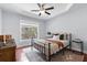 Comfortable bedroom with tray ceilings, a ceiling fan, and large windows that fill the room with natural light at 655 Mead Se St # 79, Atlanta, GA 30312