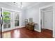 Dining area with french doors leading to a balcony, and a hallway to the bedrooms at 655 Mead Se St # 79, Atlanta, GA 30312