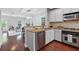 Bright kitchen featuring stainless steel appliances, granite countertops, and an open view of the dining room at 655 Mead Se St # 79, Atlanta, GA 30312