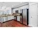Kitchen showcasing stainless steel appliances, white cabinets, and granite countertops with an adjacent pantry at 655 Mead Se St # 79, Atlanta, GA 30312