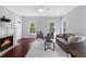 Bright living room features a fireplace, an open floor plan and hardwood floors at 655 Mead Se St # 79, Atlanta, GA 30312