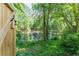 Scenic backyard pond view surrounded by lush greenery, offering a tranquil and private outdoor space at 988 Gentry Sw Ln, Marietta, GA 30064
