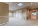 Finished basement with neutral carpet, white trim, and multiple storage options at 988 Gentry Sw Ln, Marietta, GA 30064