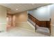 View of the basement featuring stairs, carpet, and neutral walls at 988 Gentry Sw Ln, Marietta, GA 30064