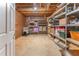 Unfinished basement with shelving, offering ample storage solutions at 988 Gentry Sw Ln, Marietta, GA 30064