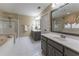Bathroom features a soaking tub, glass-enclosed shower, and double sink vanity at 988 Gentry Sw Ln, Marietta, GA 30064