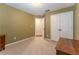 Bedroom with closet, neutral carpet, and warm toned walls at 988 Gentry Sw Ln, Marietta, GA 30064