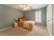 Bedroom featuring a ceiling fan, a window with plantation shutters, and ample sunlight at 988 Gentry Sw Ln, Marietta, GA 30064