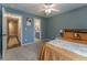 Bedroom features carpet, neutral colors, ceiling fan, and ensuite bathroom access at 988 Gentry Sw Ln, Marietta, GA 30064